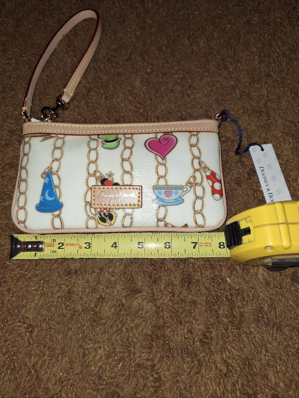 Dooney & Bourke Disney Cream Wristlet w/ Multicolor Charm Print, Like New w/tags - Picture 4 of 7